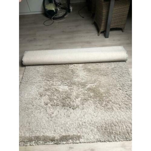 Hoogpolig vloerkleed beige
