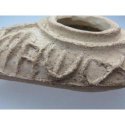 Byzantine oil lamp with the text: God shines his light on yo